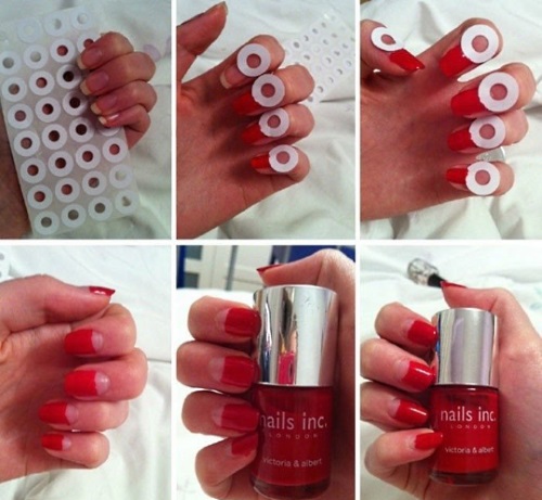 Manicure em tons de vermelho. Foto goma laca com strass, brilhos, polimento em gel. Tendências da moda